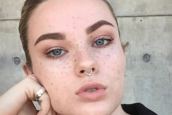 White female with combo microbladed eyebrows and freckles