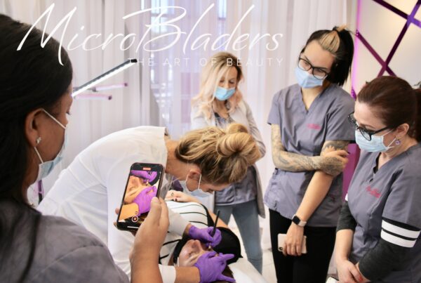Microblading students observing instructor